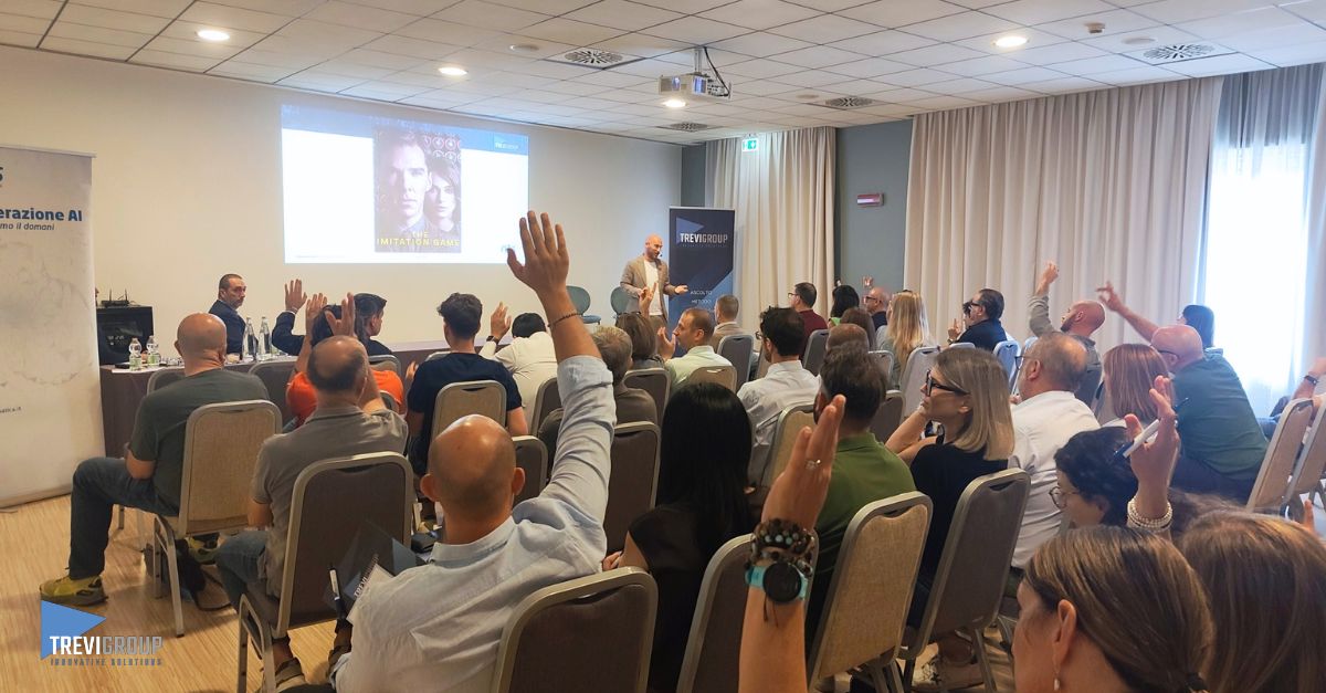 Generazione AI - Intervento di NTS Evento Generazione AI con pubblico in sala che partecipa all’intervento di NTS, alzando la mano durante una sessione dedicata all’intelligenza artificiale.